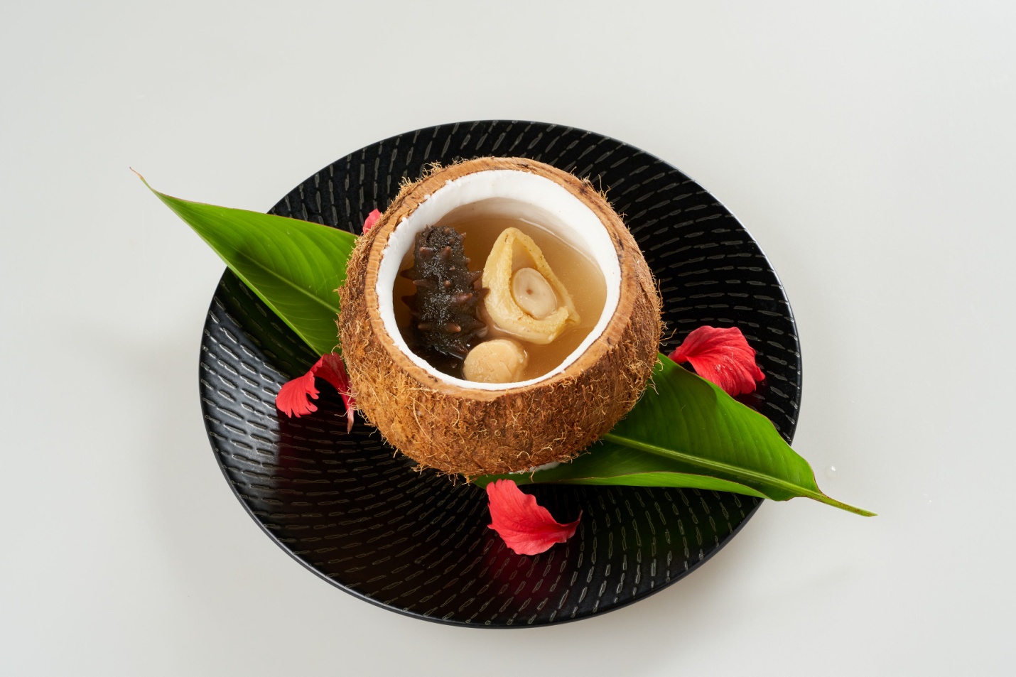 C:\Users\GCPI-ROBBY\Desktop\PRS\WHIMSICAL SELECTIONS AT TEA OF SPRING\Soup- Double-boiled Abalone and Dried Scallop served in a Coconut Shell.png