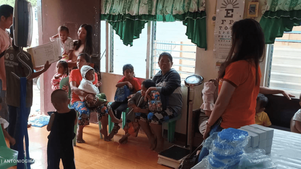 A group of people in a room Description automatically generated