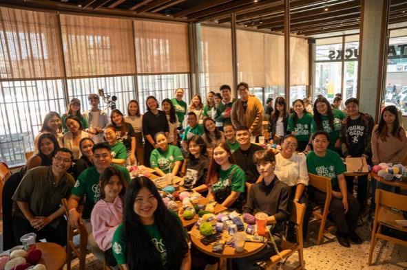 A group of people posing for a photo AI-generated content may be incorrect.