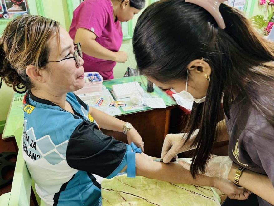 A person getting blood from a nurse AI-generated content may be incorrect., Picture