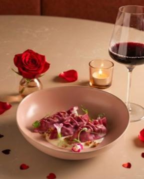 A plate of food and a glass of wine AI-generated content may be incorrect.