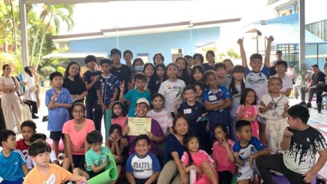 5 - Teacher Janice taking the photo opportunity after her yoga session with the students and their parents